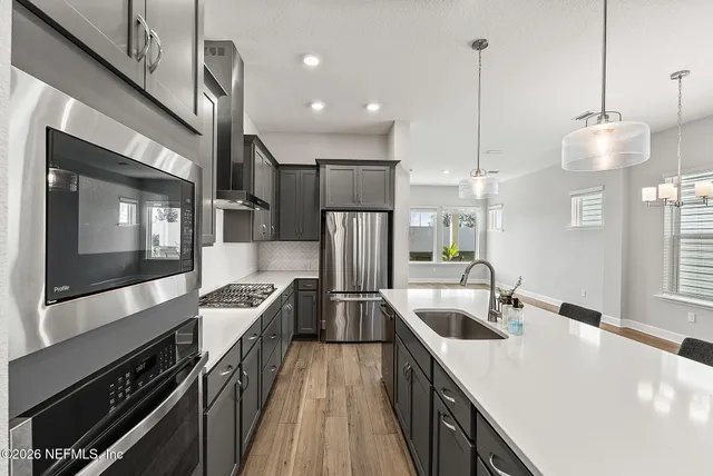 a bedroom with bed and a potted plant