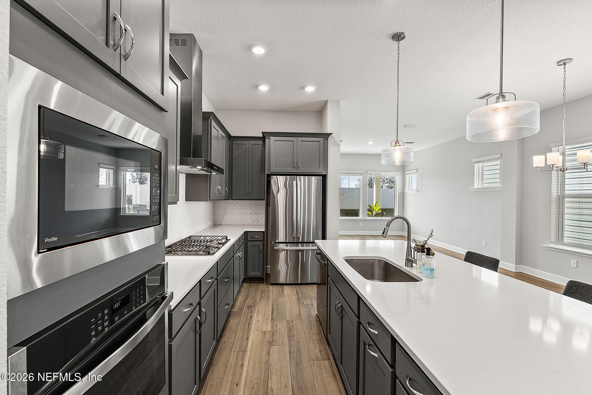 11465 Catalyst Road Jacksonville, FL 32256 - Photo 7 of 61 a kitchen with stainless steel appliances granite countertop a sink a stove and a refrigerator