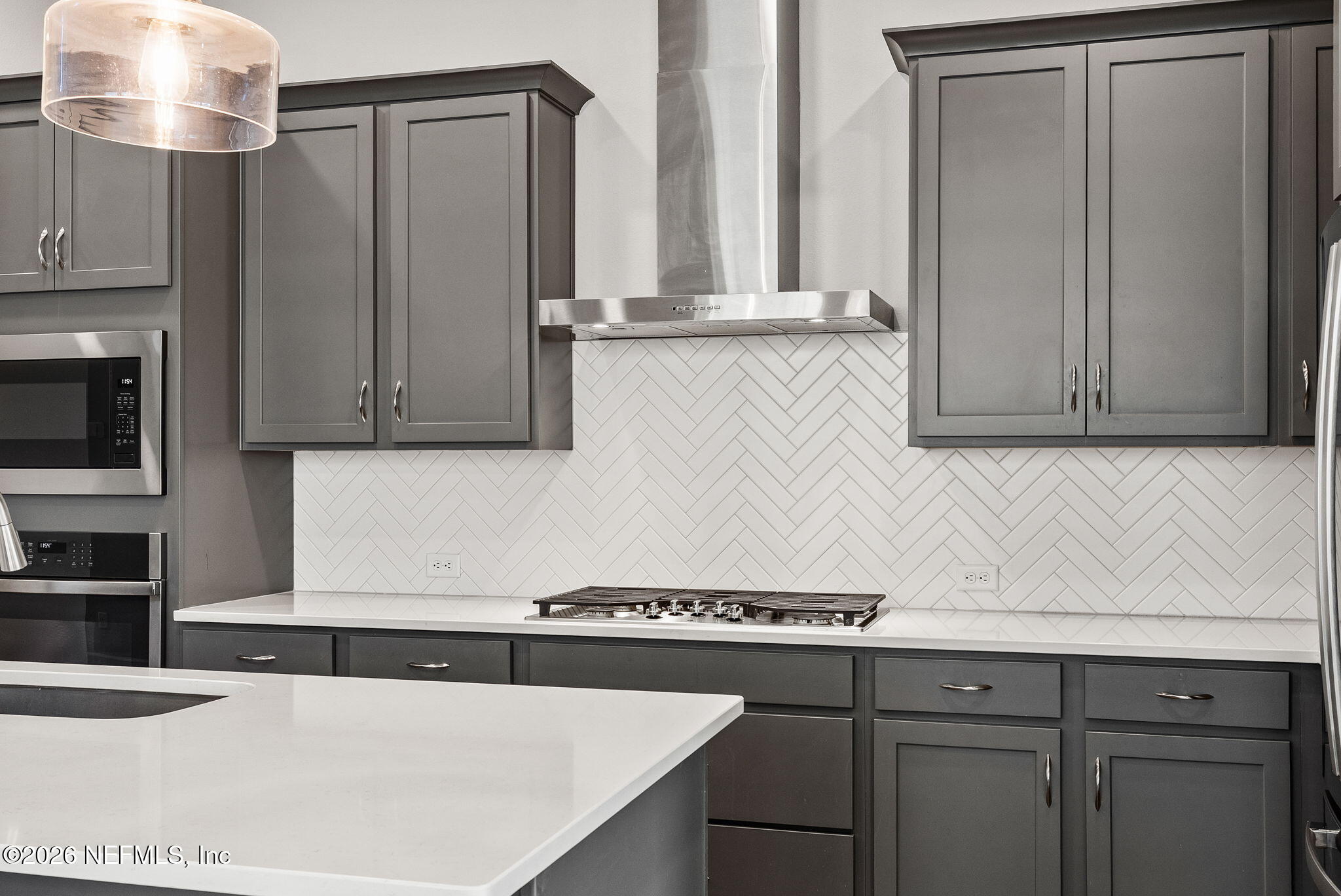 11465 Catalyst Road Jacksonville, FL 32256 - Photo 10 of 61 a kitchen with stainless steel appliances granite countertop a sink a stove and a microwave