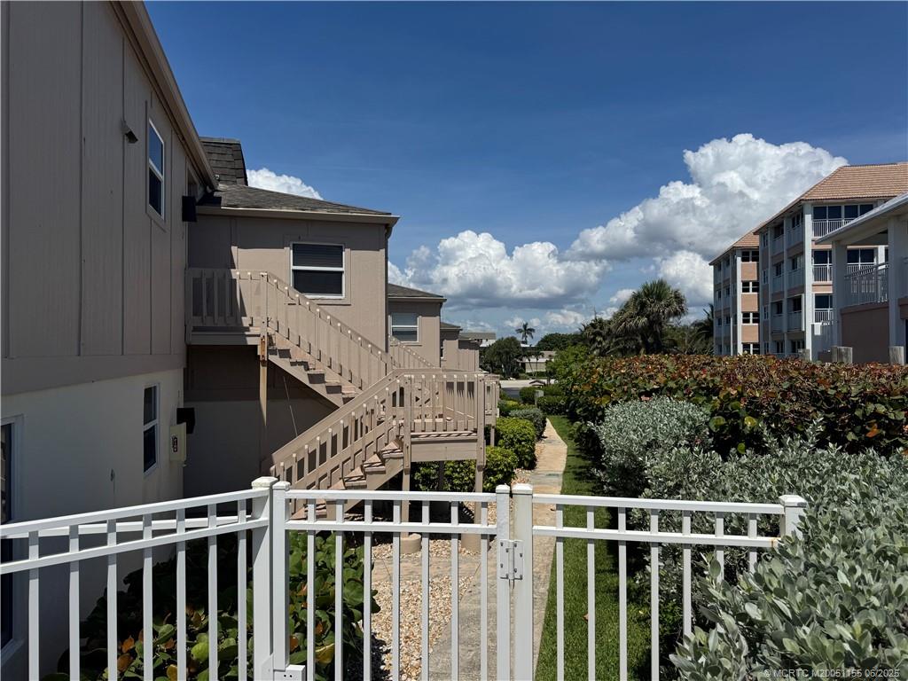 1501 Northeast Ocean Boulevard, Unit 9 Stuart, FL 34996 - Photo 11 of 41 a front view of a house with balcony