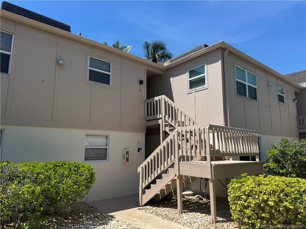 1501 Northeast Ocean Boulevard, Unit 9 Stuart, FL 34996 - Photo 12 of 41 a front view of a house with garden