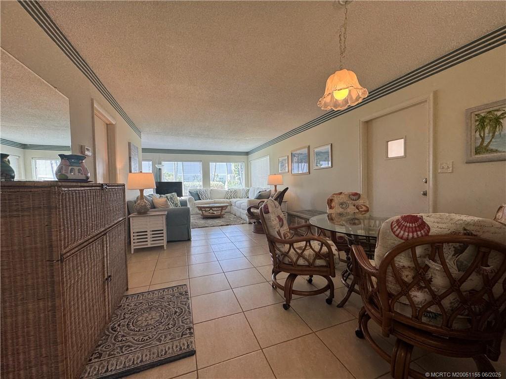 1501 Northeast Ocean Boulevard, Unit 9 Stuart, FL 34996 - Photo 19 of 41 a living room with furniture