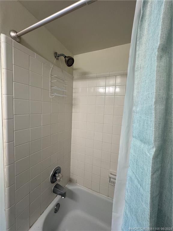 1501 Northeast Ocean Boulevard, Unit 9 Stuart, FL 34996 - Photo 30 of 41 a bathroom with a glass shower door