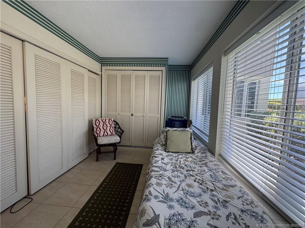 1501 Northeast Ocean Boulevard, Unit 9 Stuart, FL 34996 - Photo 33 of 41 a view of a hallway with a chair