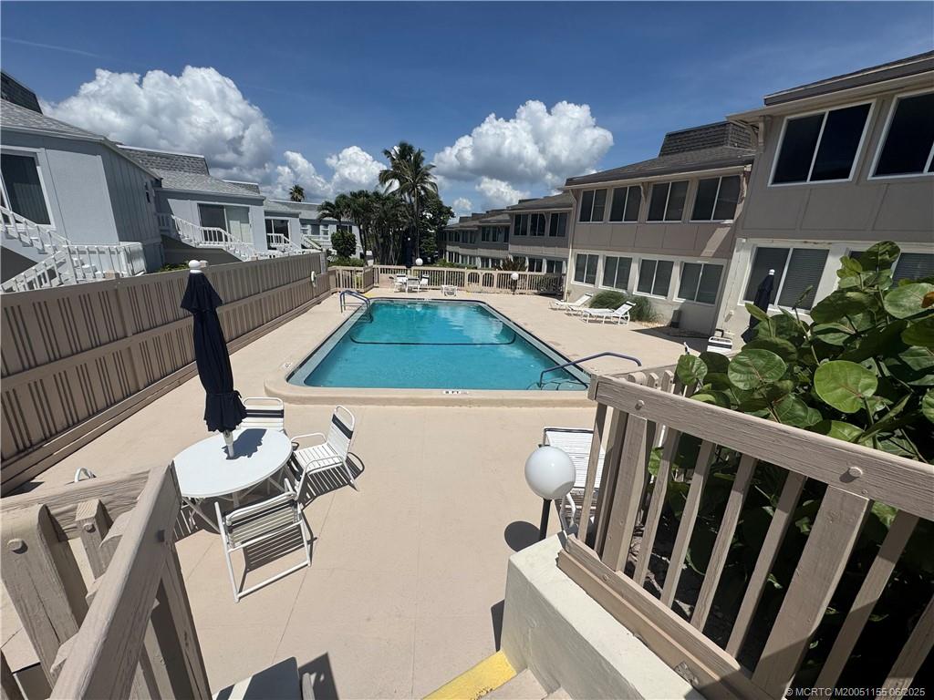 1501 Northeast Ocean Boulevard, Unit 9 Stuart, FL 34996 - Photo 36 of 41 a view of an chairs and tables in the patio