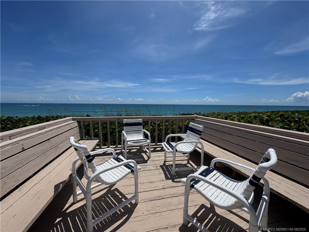 1501 Northeast Ocean Boulevard, Unit 9 Stuart, FL 34996 - Photo 38 of 41 a view of a balcony with chairs and wooden floor