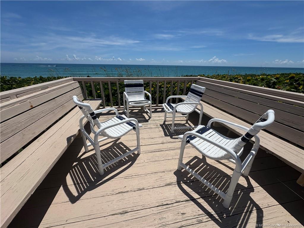 1501 Northeast Ocean Boulevard, Unit 9 Stuart, FL 34996 - Photo 7 of 41 a view of a roof deck with couches and sky view