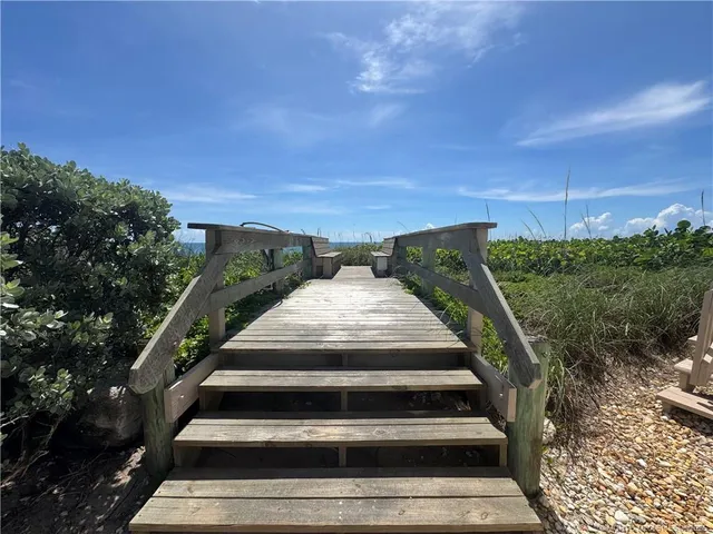 a view of stairs and flowers