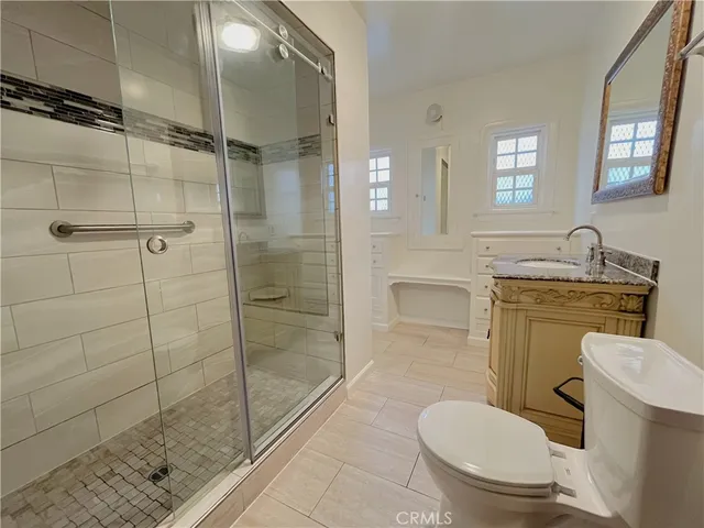 a bathroom with a bathtub a sink a vanity and a window