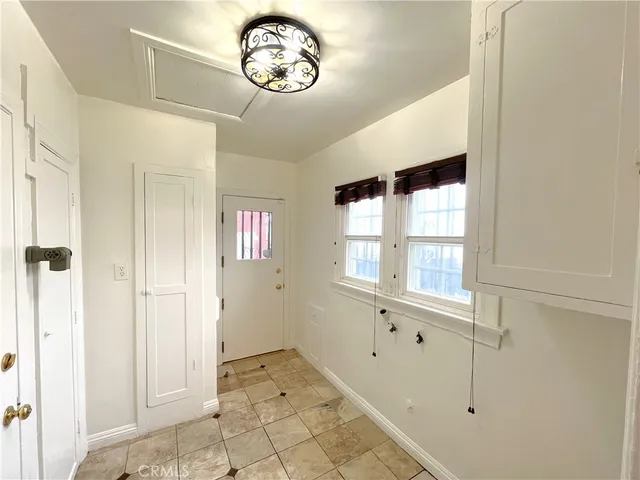 a view of an entryway with wooden floor