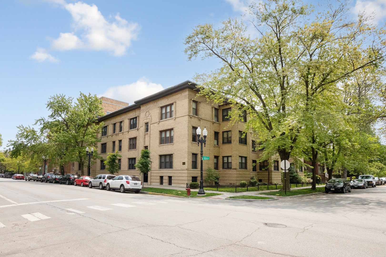 1243 West Morse Avenue, Unit 2 Chicago, IL 60626 - Photo 1 of 13 a building exterior with stairs and trees