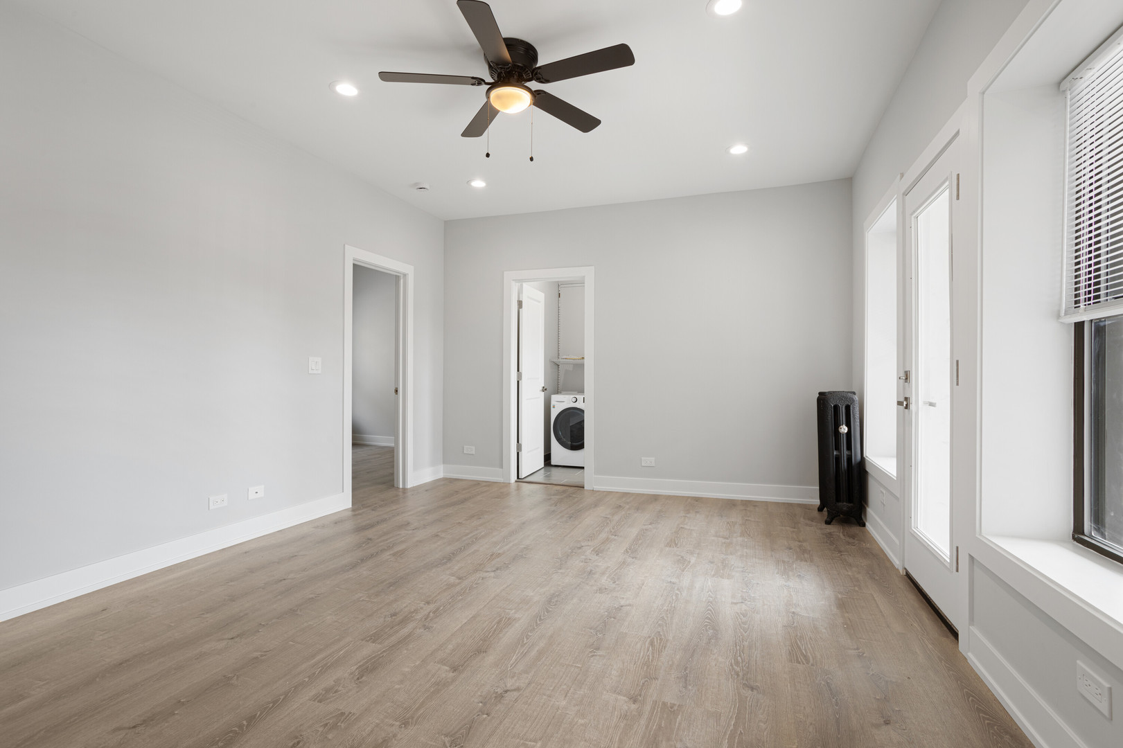 1243 West Morse Avenue, Unit 2 Chicago, IL 60626 - Photo 6 of 13 wooden floor in an empty room with a window