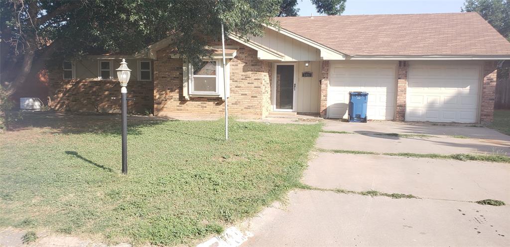 1410 Sunnyvale Street Sweetwater, TX 79556 - Photo 1 of 1 a backyard of a house with portable tub and trees
