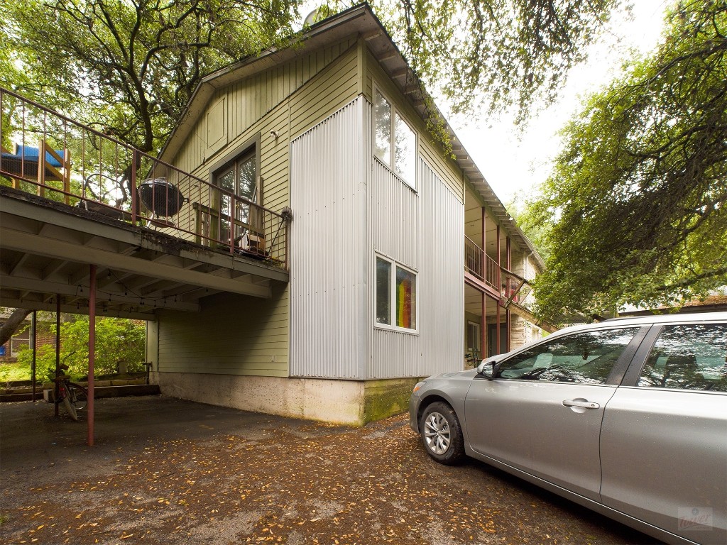 915 Keith Lane, Unit 104 Austin, TX 78705 - Photo 14 of 14 a view of a house with a patio