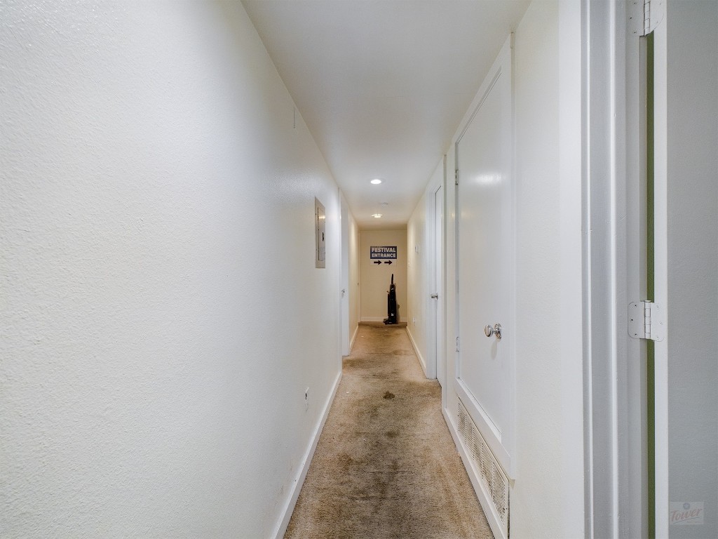 915 Keith Lane, Unit 104 Austin, TX 78705 - Photo 8 of 14 a view of a hallway with a white door