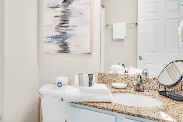a view of a patio with furniture and cars parked