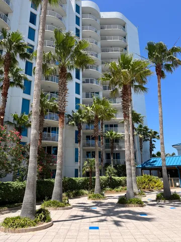 a view of a porch with a floor to ceiling window next to a yard