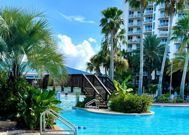 a view of balcony with wooden floor and fence