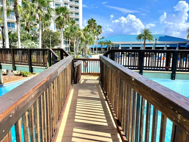 a view of building with garden and street