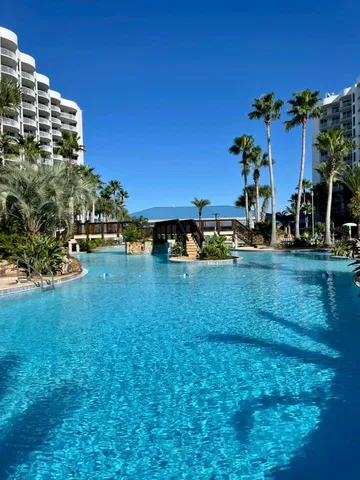 a view of a street with sign on the wall