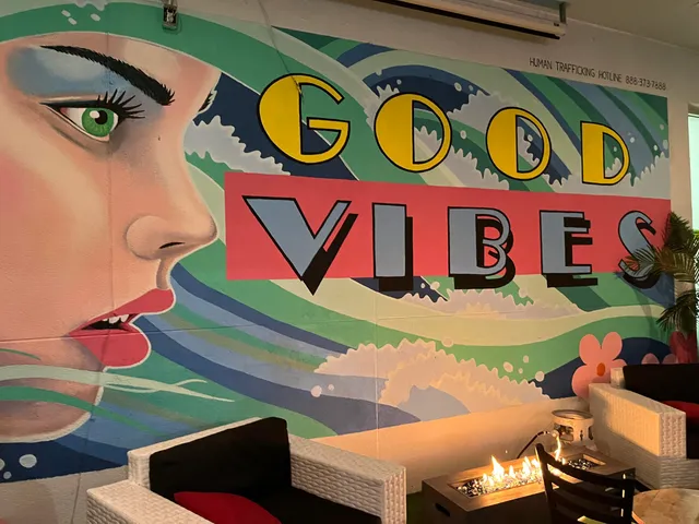 a blue car parked in front of a house