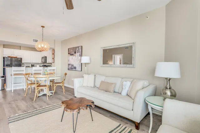 a living room with furniture and a lamp