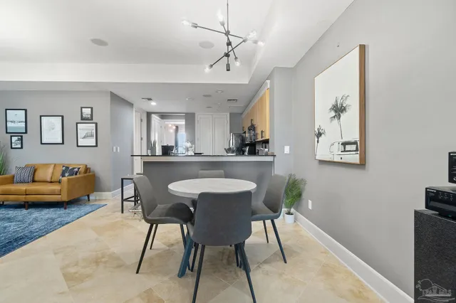 a view of a dining room with furniture and a window