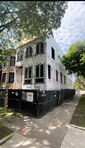 a front view of a house with parking