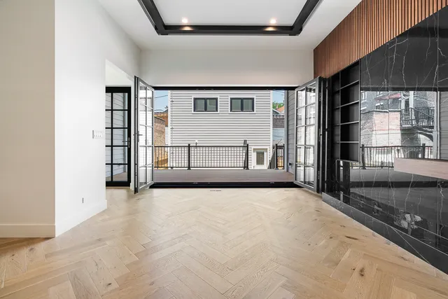 a view of an empty room with a fireplace