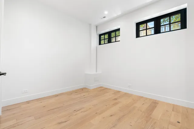 a bathroom with a granite countertop sink mirror and toilet