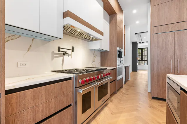 a view of a kitchen with a sink and a window