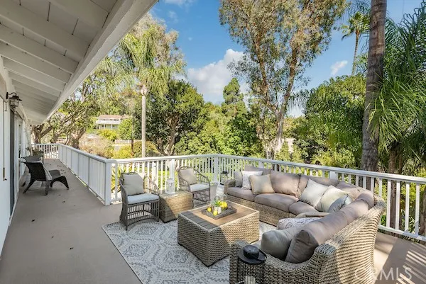 a dining room with furniture a chandelier and a rug