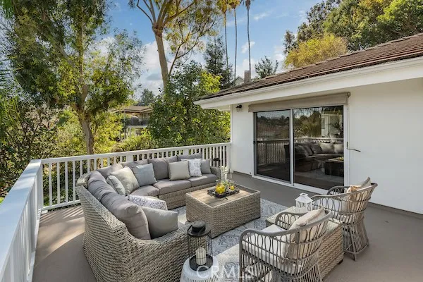 a kitchen with stainless steel appliances granite countertop a refrigerator a sink and white cabinets
