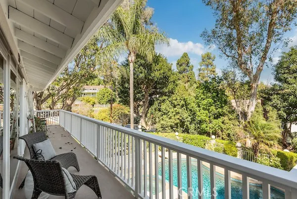 a kitchen with stainless steel appliances granite countertop a refrigerator sink and stove