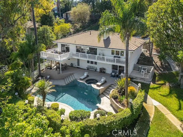 a view of a patio with table and chairs and potted plants