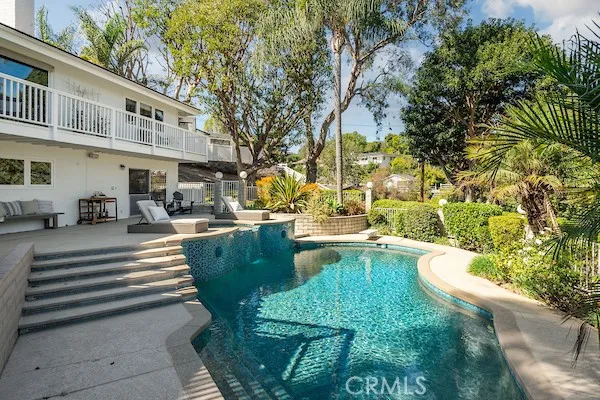 a view of a chairs and table in the patio
