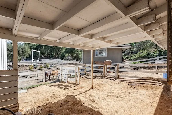a view of house with outdoor space and deck