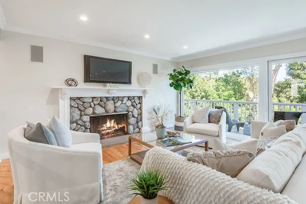 a outdoor living room with furniture and a potted plant