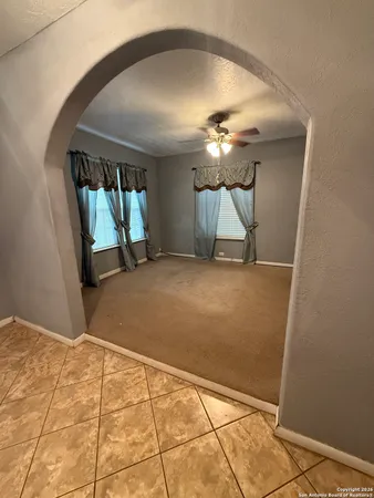 a view of a hallway with a chandelier