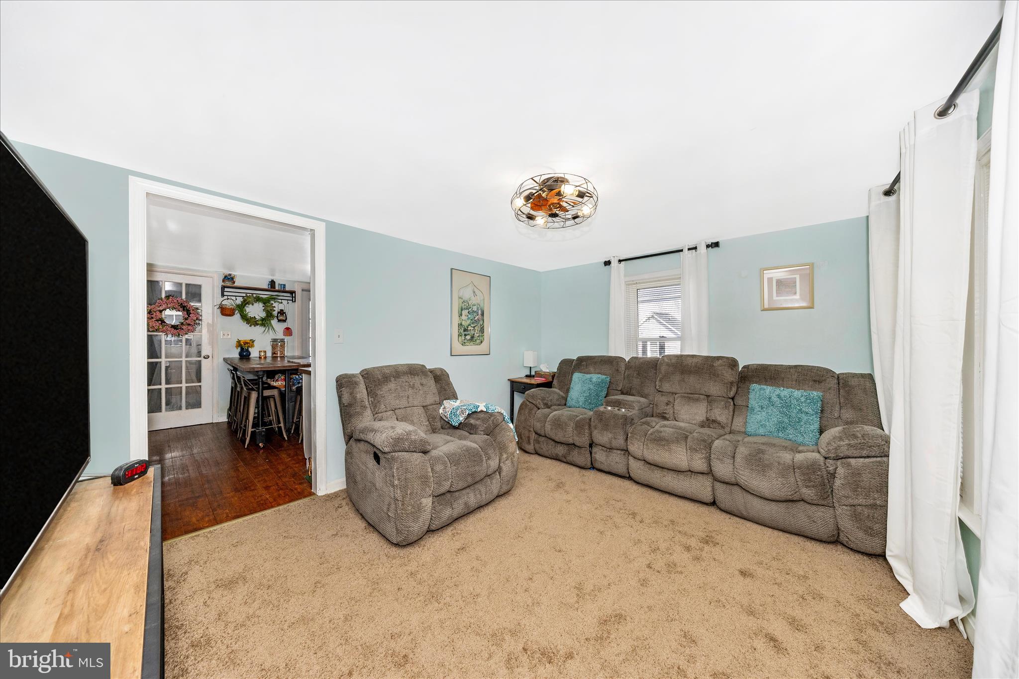 5618 Bartonsville Road Frederick, MD 21704 - Photo 3 of 53 a living room with furniture and a flat screen tv