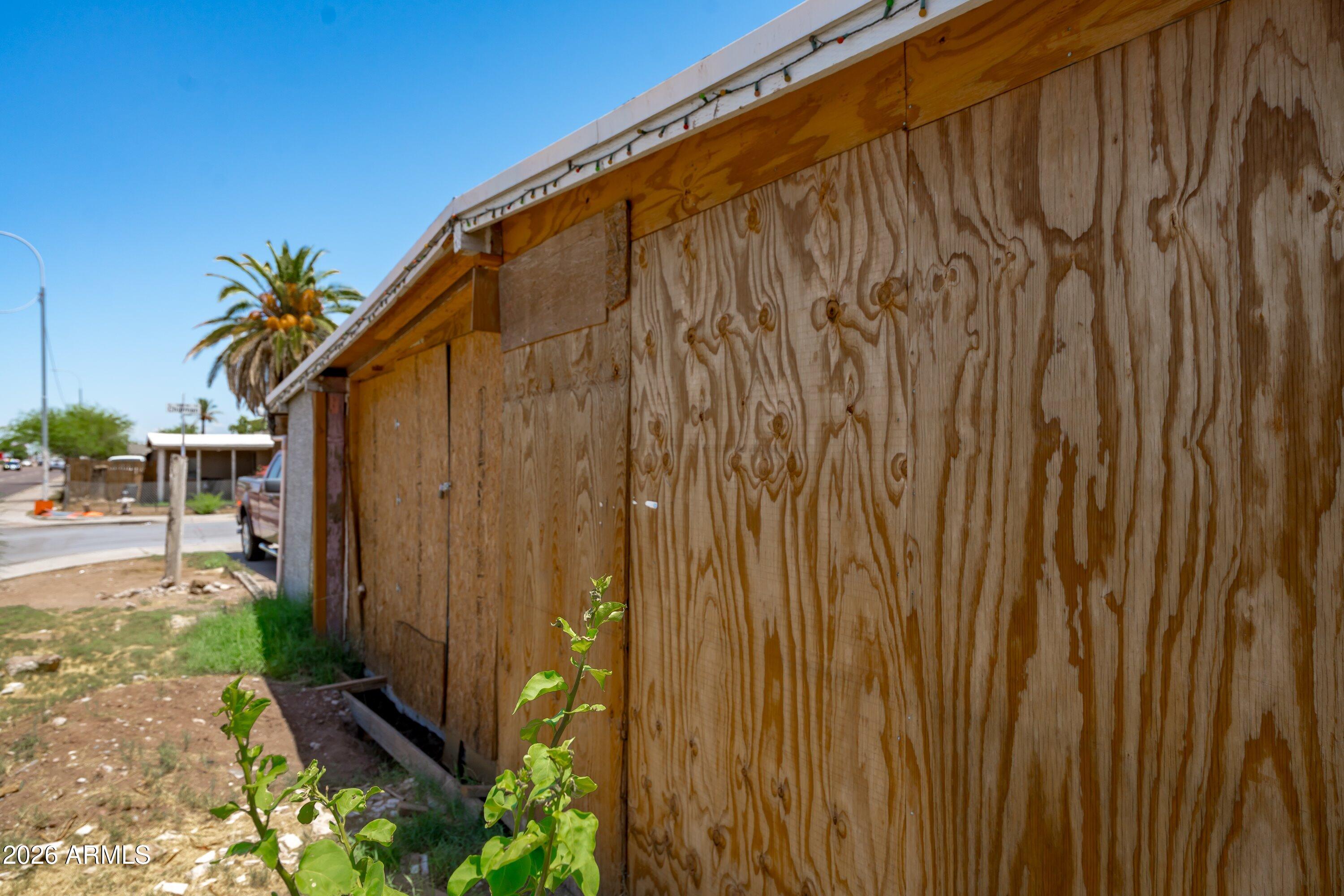 1845 West Chipman Road Phoenix, AZ 85041 - Photo 5 of 24 05-Side Damage