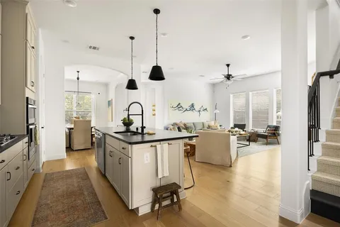 a kitchen with stove and cabinets