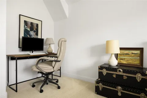 a room with furniture and air hockey table