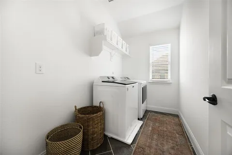 a view of a hallway with washer and dryer
