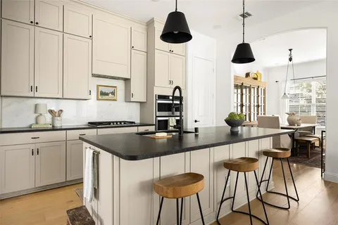 a kitchen with stainless steel appliances granite countertop counter space a sink and cabinets