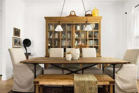 a view of a dining room with furniture and window