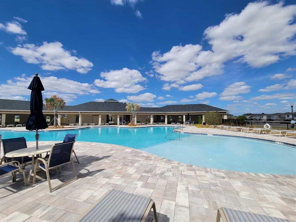 4513 Southwest 91st Ln Road Ocala, FL 34476 - Photo 25 of 36 a view of a house with swimming pool and sitting area