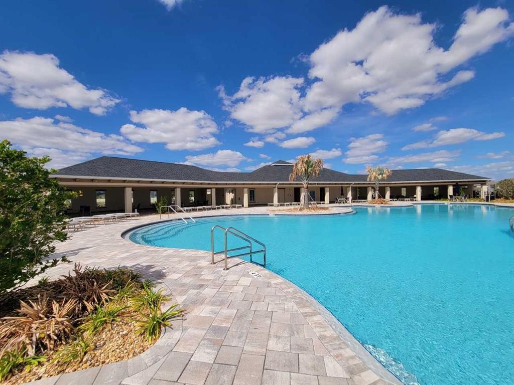 4513 Southwest 91st Ln Road Ocala, FL 34476 - Photo 29 of 36 a front view of a house with a yard