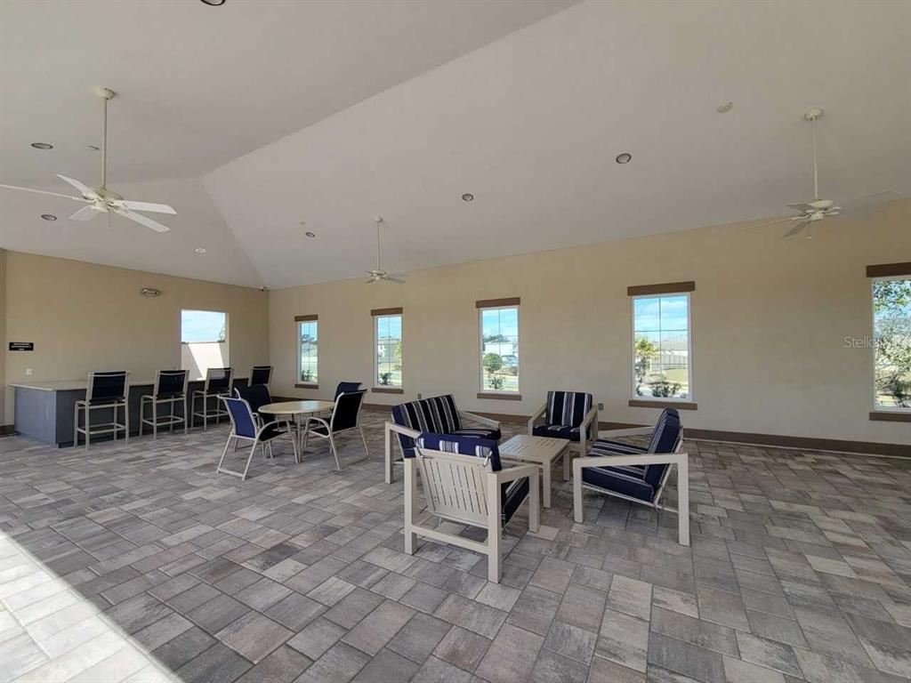 4513 Southwest 91st Ln Road Ocala, FL 34476 - Photo 31 of 36 a view of a dining room with furniture