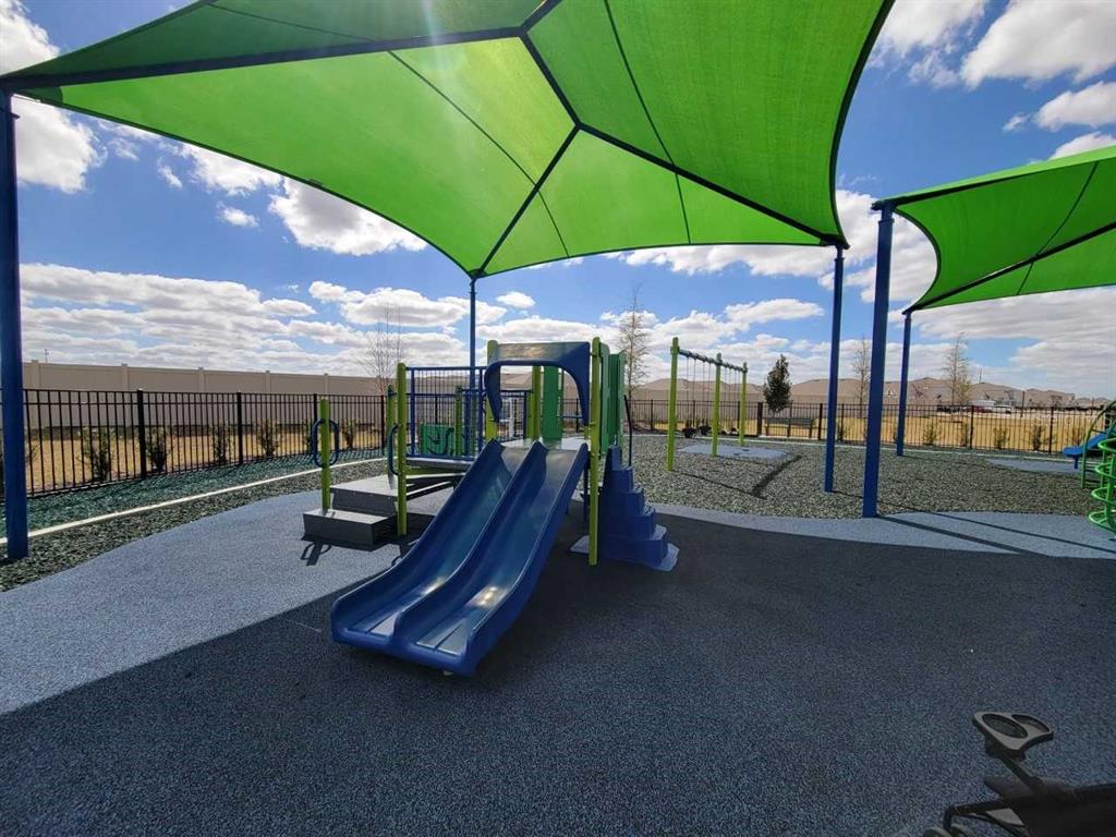 4513 Southwest 91st Ln Road Ocala, FL 34476 - Photo 34 of 36 a view of a swimming pool with lawn chairs under an umbrella